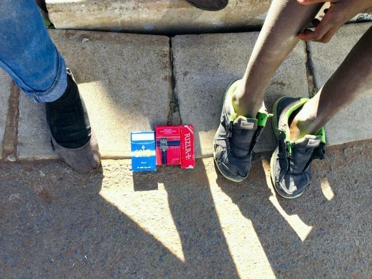 School Children Sell Cigarettes to Help Parents Make Ends Meet cigarette