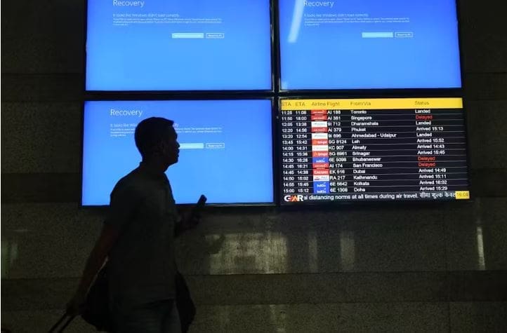 What Is CrowdStrike Falcon And How Does It Ensure My Computer’s Safety? A passenger passes malfunctioning information screens at Delhi airport, India, July 19 2024. EPA/Rajat Gupta