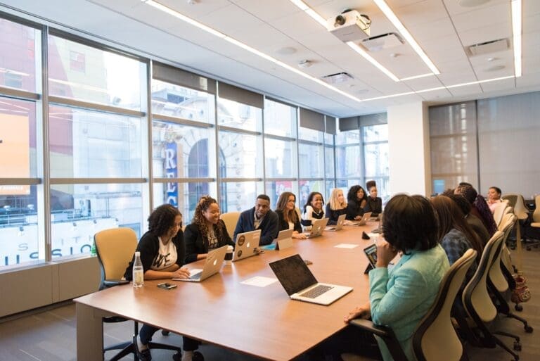 Maximizing Resource Utilization In Business: Strategies For Efficiency And Sustainability A team of professionals collaborating to optimize operational workflows for better resource utilization.